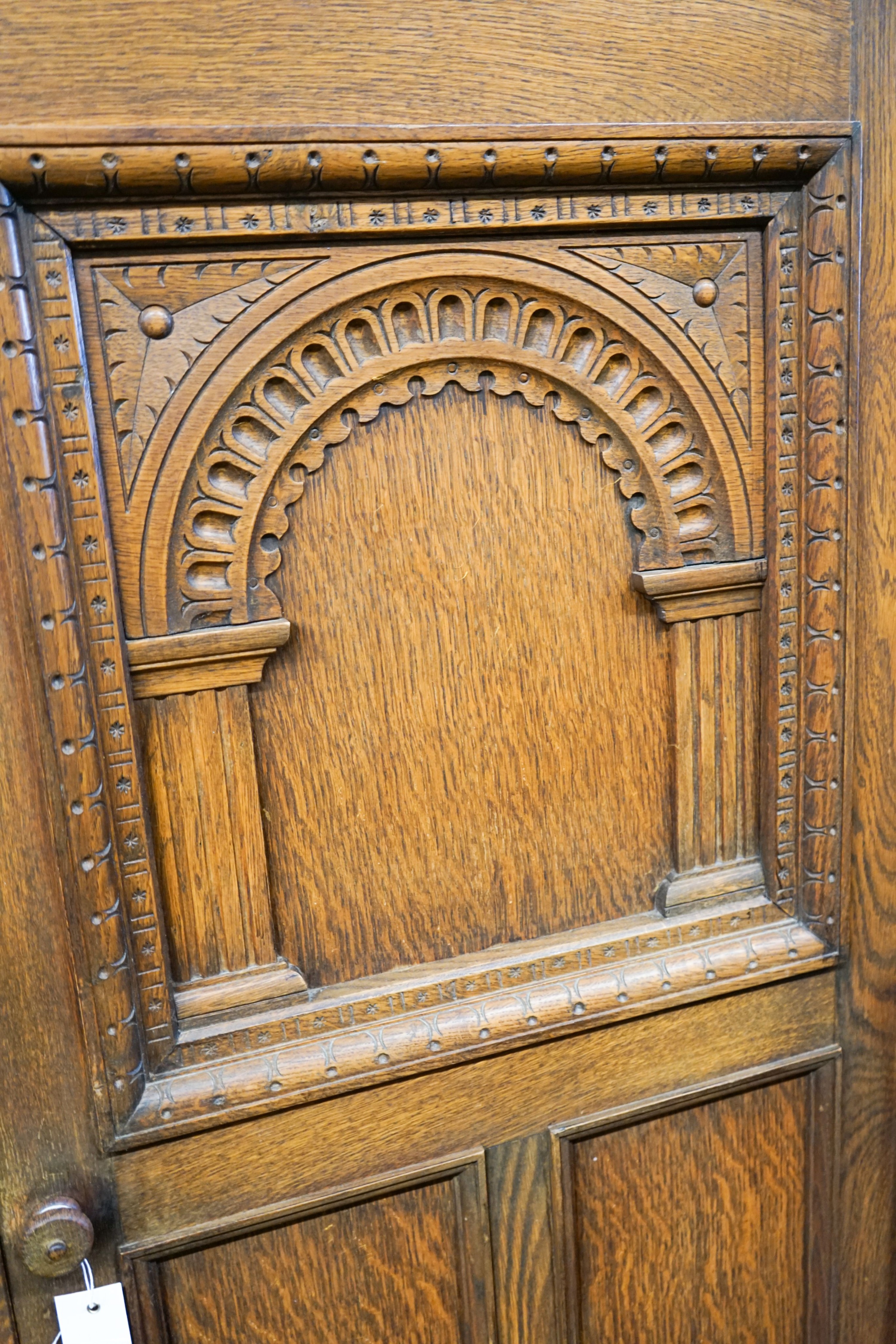 An 18th century style carved oak hall cupboard, length 91cm, depth 50cm, height 180cm
